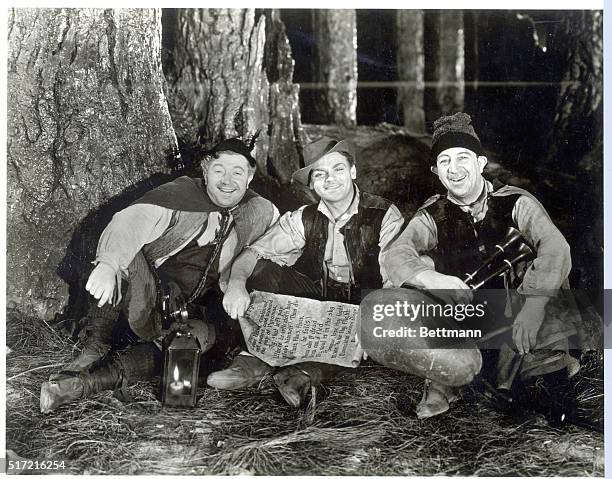 Picture shows a scene from the movie, "A Midsummer Night's Dream". Left to right: Frank McHugh, James Cagney and Hugh Herbert are the three rusty...