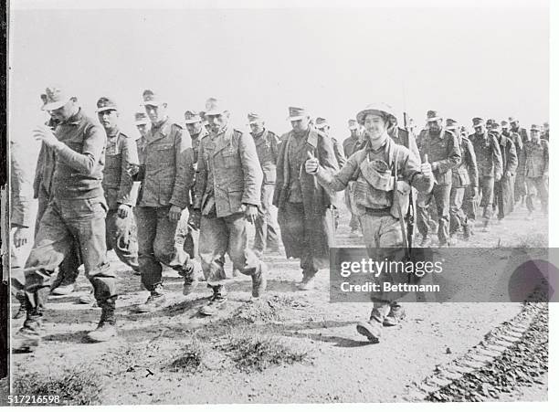 The first Axis Prisoners captured by British garrison of Tobruk after the opening of the current Allied offensive, are being escorted to the rear by...