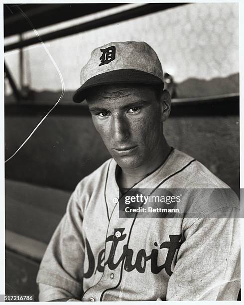 While Hank Greenberg, husky first baseman and star batsman of the Champion Detroit Tigers, "sulks" in his Bronx, New York home awaiting a salary...