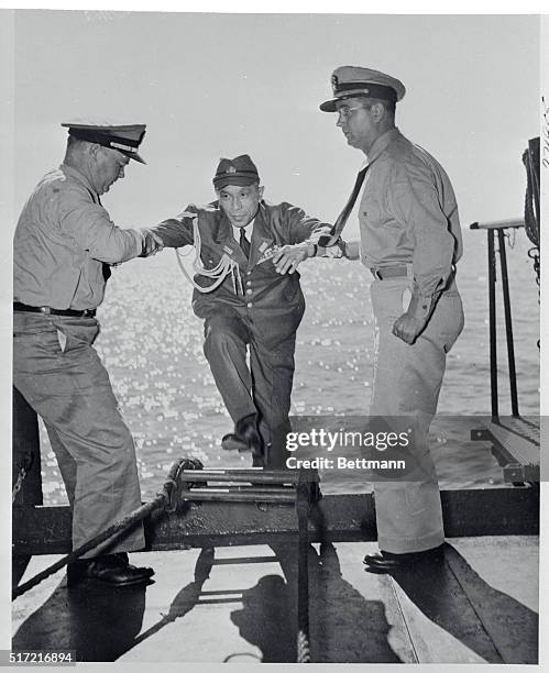 Jap Gets an Assist. Rear Admiral Densuke Kanome, Chief of Staff of the Ominate Naval Base, is assisted aboard the USS Panamint by Chief Bos'n W....