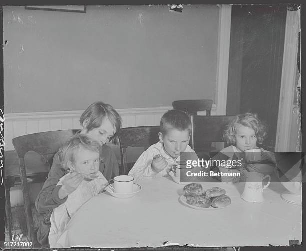 Their First Good Meal in a Long While. Facing starvation, these children were saved by the S.P.C.C. When their mother Mrs. Margaret Costello, who...