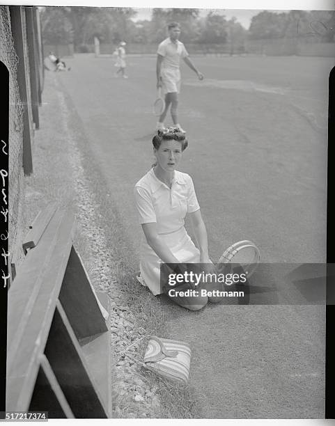 Mrs. Sarah Palfrey Cooke, rests after defeating Miss Jane Stanton 6-1 7-5, in second round of women's singles in annual Seabright invitation tennis...