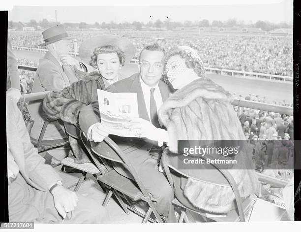Claudette Colbert , film actress, is the guest of Mr. And Mrs. William Goetz in their Churchill Downs Box Aon Kentucky Derby Day, May 6. Movie...