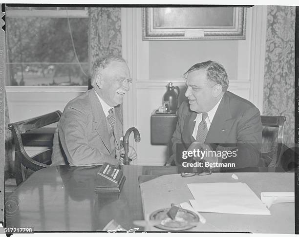 His Hat's in the ring again. New York: Mayor Fiorello LaGuardia of New York City right, confers with Charles Burlingham Fusion Chief at City Hall,...