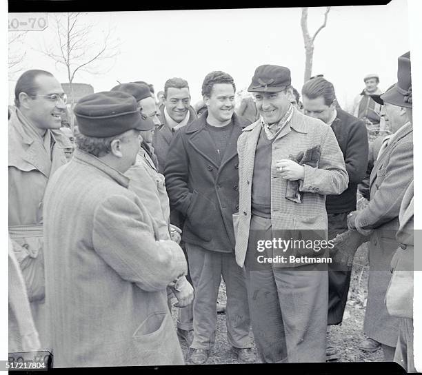 No Cigars? Monterossi, Italy: Italian movie director Roberto Rossellini is surrounded by congratulating members of his film crew after the birth of a...