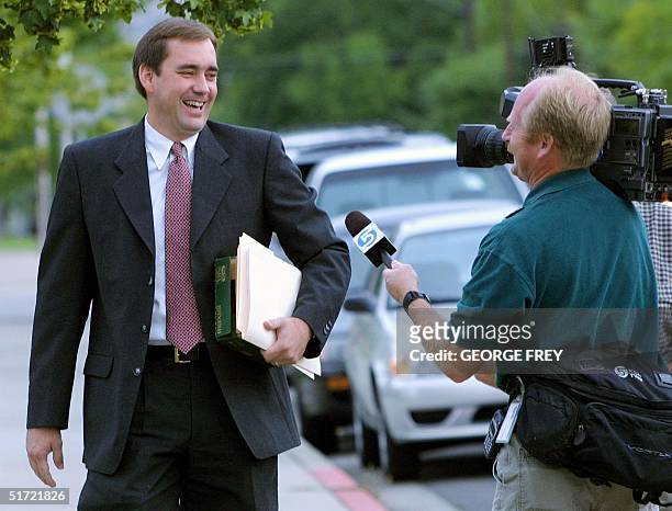 David Leavitt , Juab County prosecutor in the Tom Green bigamy trial, has fun with a TV cameraman as he enters Fourth District Court in Provo, Utah...