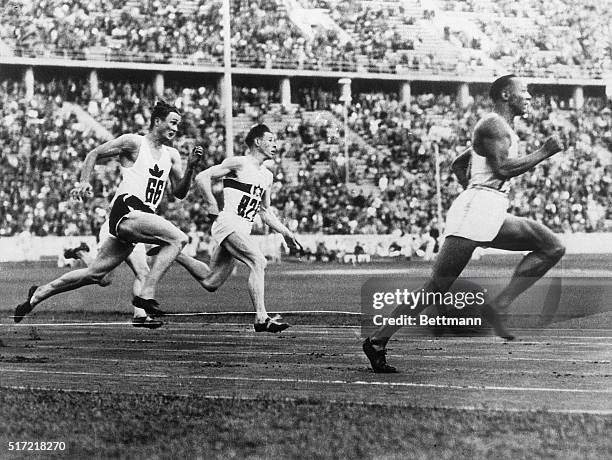 Berlin, Germany- Jesse Owens, who won four events in the Olympic games, is shown winning one of the 200-meter heats. L. Orr of Canada is second and...