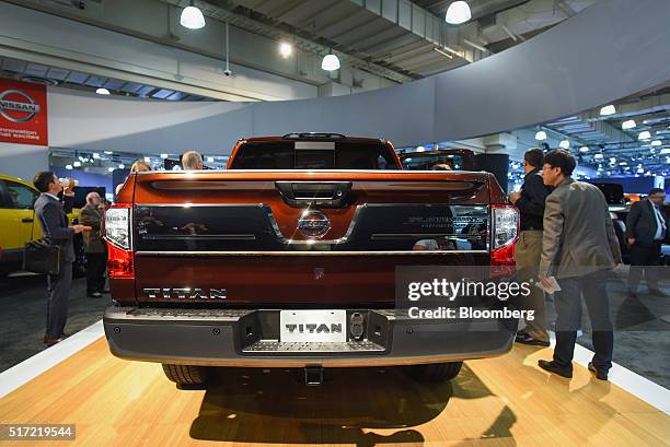 Attendees view the 2017 Nissan Motor Co. Titan pickup truck during the 2016 New York International Auto Show in New York, U.S., on Thursday, March...