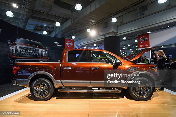 An attendee views the 2017 Nissan Motor Co. Titan pickup truck during the 2016 New York International Auto Show in New York, U.S., on Thursday, March...