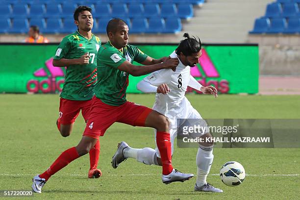 Bangladesh's midfielder Jamal Bhuyan vies with Jordan's Yousef Mazen al-Naber during their World Cup 2018 Asian qualifying football match on March...