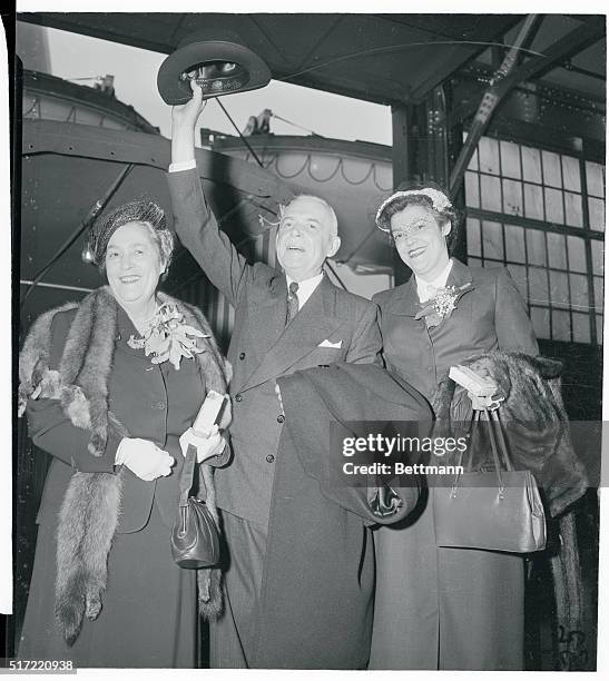 Canadian Prime Minister Louis St. Laurent, Mrs. Laurent, and their daughter, Therese Flaherty make a happy trio on board the Queen Elizabeth, shortly...