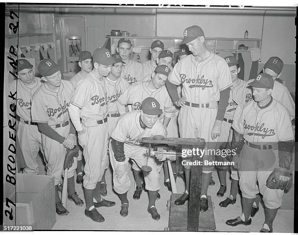 "The Lip" Check 'Em In. Bear Mountain, New York: Leo Durocher, manager of the Brooklyn Dodgers, weighs in Curt Davis while other members of the...