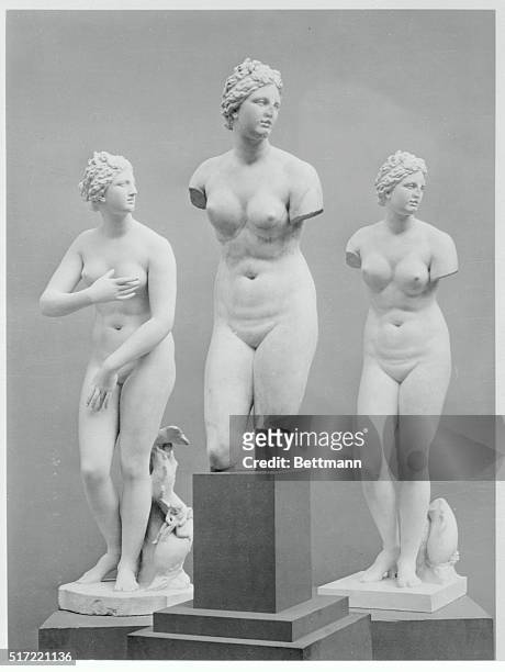 Photo shows three similar statues of Aphrodite in the collection of the Metropolitan Museum of New York City. The ancient replica of a Greek work...