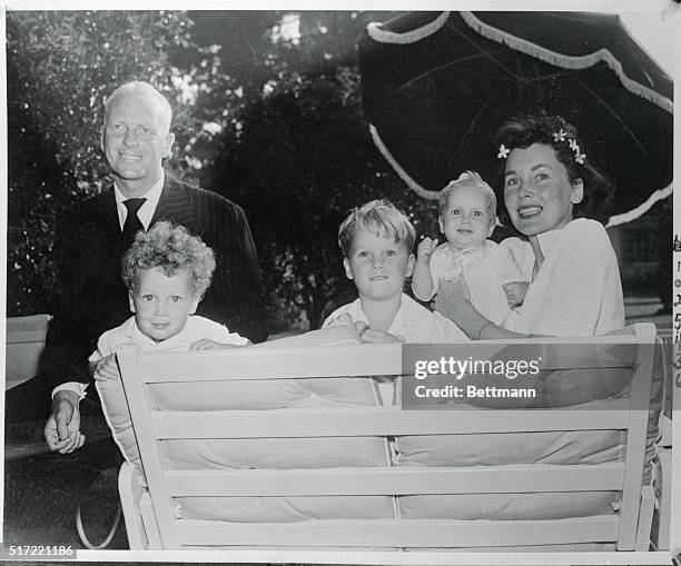 Director John Farrow, whose next production for Paramount will be Two Years Before The Mast, starring Alan Ladd, is shown at his Hollywood home with...