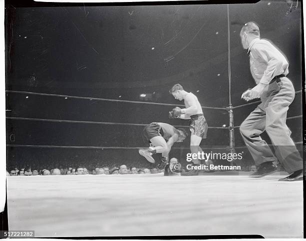 Beau Jack, flashy Augusta, Georgia, fighter and leading contender for the welterweight crown is pictured in midair from the momentum of a miss in the...