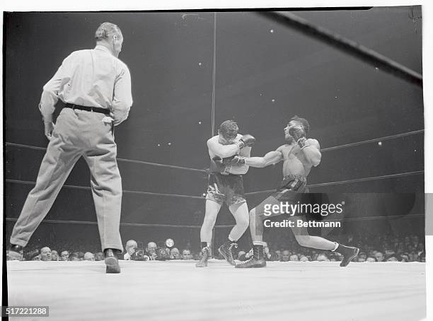 Morris Reif of Brooklyn got in this hard right to the side of Beau Jack's jaw right in the first round of their Garden fight. The welterweight...