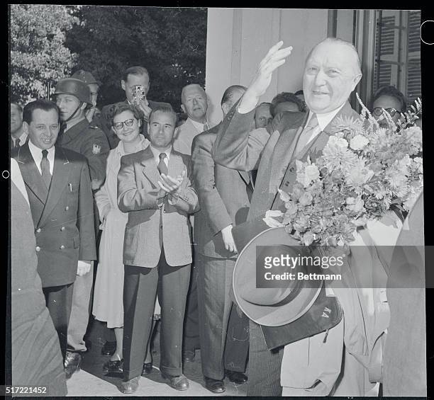 Adenauer Wins Election. Bonn, West Germany: Victorious Chancellor Konrad Adenauer waves to friends upon arriving at the Bonn chancellery. Adenauer...