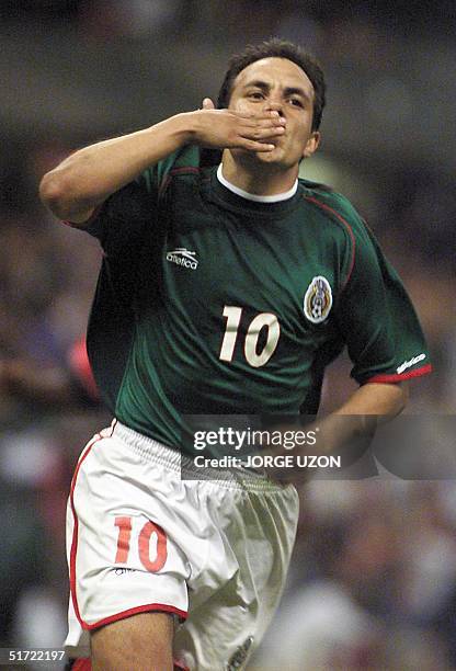 Cuauhtemoc Blanco of Mexico throws a kiss in celebration of his third goal during the game against Tridad and Tobago for the World Cup tryouts in...