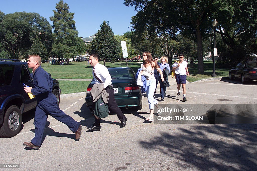 People evacuate the area around the White House in