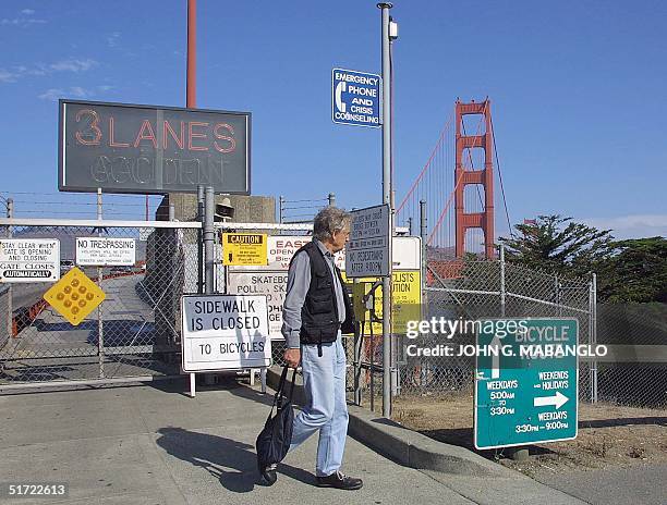 Pedestrian walks away from the Golden Gate Bridge walkway after it was closed due to the terrorist attacks in New York and Washington D.C., 11...