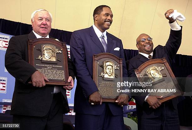 The 2001 Baseball Hall of Fame inductees Kirby Puckett , Dave Winfield and Bill Mazeroski pose with their plaques after the induction ceremony in...
