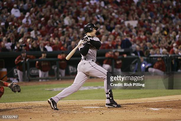 Carlos Beltran of the Houston Astros bats during game one of the NLCS against the St. Louis Cardinals at Busch Stadium on October 13, 2004 in St....