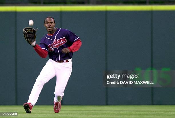 Cleveland Indians' center fielder Kenny Lofton catches a ball hit by Minnesota Twins' batter Torii Hunter in the second inning 14 August 2001 at...