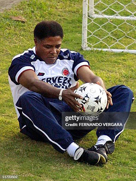 The Colombian soccer coach, Francisco Maturana, leads stretching exercises in Medellin on August 27, 2001. The team is having their first practice of...