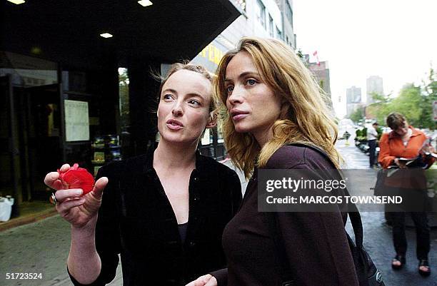 French actress Emmanuelle Beart talks to Canadian actress Pascale Bussieres outside the Imperial Theater 28 August in Montreal. Beart is a jurist at...