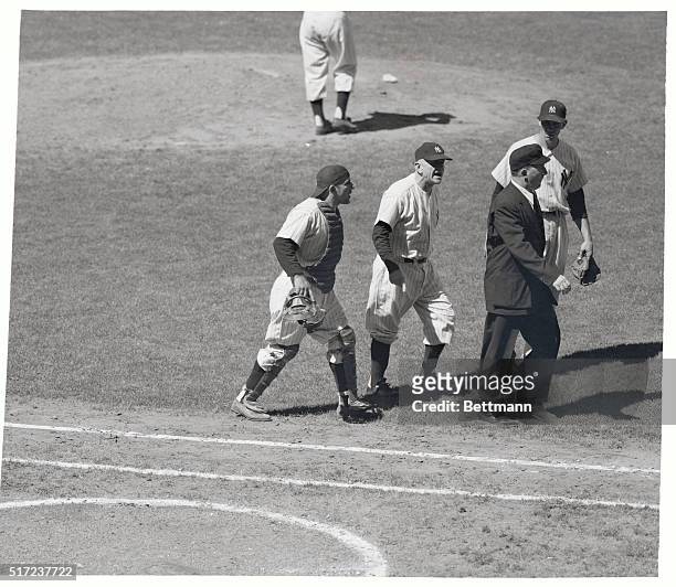 Having it out with umpire Ed Hurley in certain terms are Yankees Yogi Berra , catcher, Casey Stengel, manager and Don Bollweg , first baseman, July...
