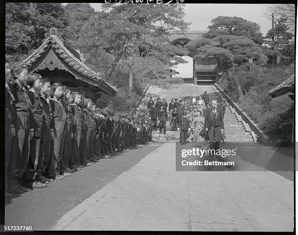 Jap Empress Attends Daughter's Graduation. Tokyo, Japan: A typical Japanese backdrop frames this scene of Empress Nagako of Japan entering Peeress'...