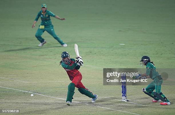 Jahanara Alam, Captain of Bangladesh hits out with Sidra Nawaz of Pakistan looking on during the Women's ICC World Twenty20 India 2016 match between...