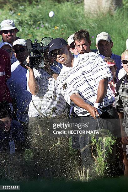 Tiger Woods putts on the rough of the first hole at the Bighorn Golf Club during the "Lincoln Financial Group Battle at Big Horn" event in Palm...