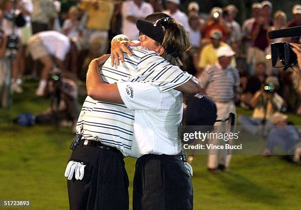 Annika Sorenstam and teammate Tiger Woods hug after winning the Lincoln Financial Group Battle at Big Horn event at the Big Horn Golf Club in Palm...