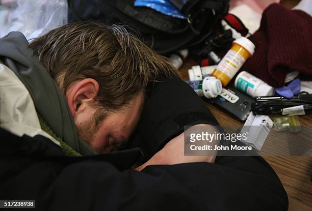 Jackson who said he is addicted to prescription medication, lies passed out in a public library on March 14, 2016 in New London, CT. Police say an...