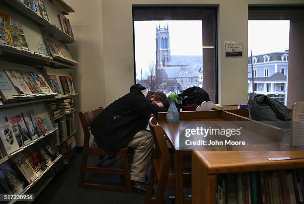 Jackson who said he is addicted to prescription medication, lies passed out in a public library on March 14, 2016 in New London, CT. Police say an...