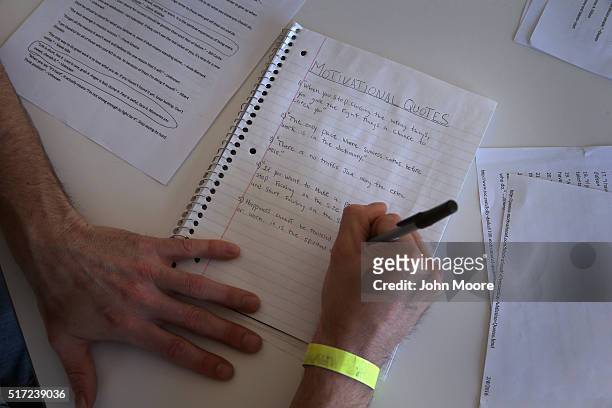 Drug addict in recovery writes a list of motivational quotes at a substance abuse treatment center on March 22, 2016 in Westborough, MA. The new...