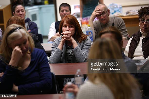 Family members of people addicted heroin and opioid pain pills share stories during a support group on March 23, 2016 in Groton, CT. The group...