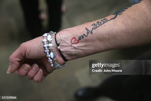 Mother, Kum Sullivan, who's son Ben died of a heroin overdose in 2015, shows off a tatoo while attending a family addiction support group on March...