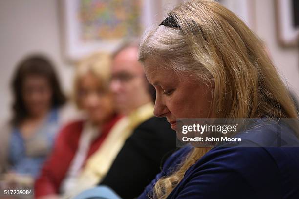 Family members of people addicted to opioid pain pills and heroin listen during a support group on March 23, 2016 in Groton, CT. The group...