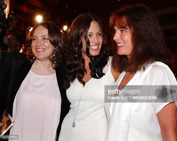 Actress Angelina Jolie chats with her mother Marcheline Bertrand and British actress Jacqueline Bisset at the premiere of her new film "Original...