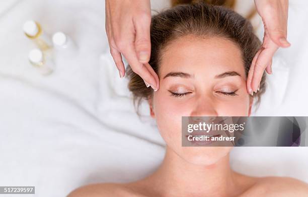 woman at the spa - facial massage stock pictures, royalty-free photos & images