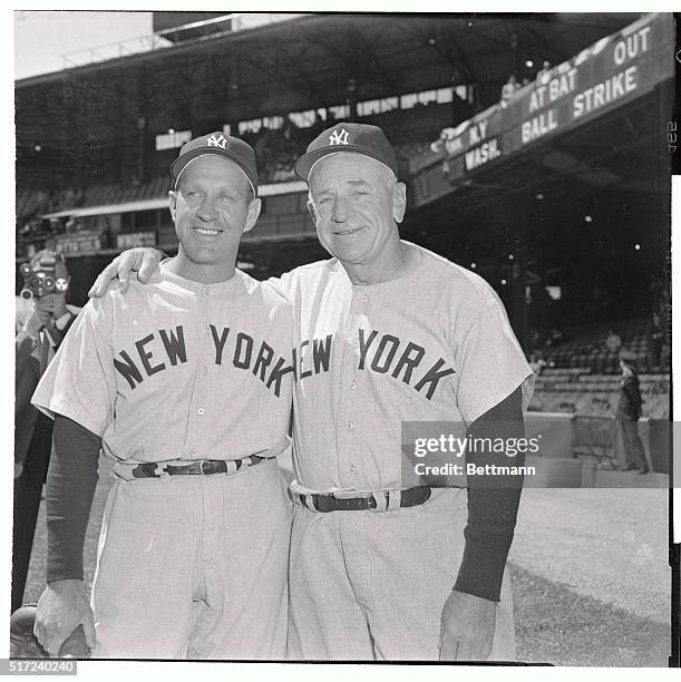 Outfielder Enos Slaughter, left, traded from the St. Louis Cardinals, reports to his new boss Yankee Manager Casey Stengel for the Washington-New...