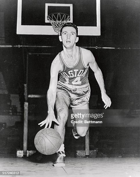 Bob Cousy, Boston Celtics basketball player is shown in this photograph.