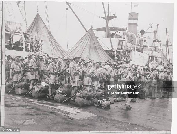 Soldiers of the 22nd Algerian Tiralleurs line up on a quay in Saigon after their arrival on the SS Pasteur. They will reinforce the beleaguered...