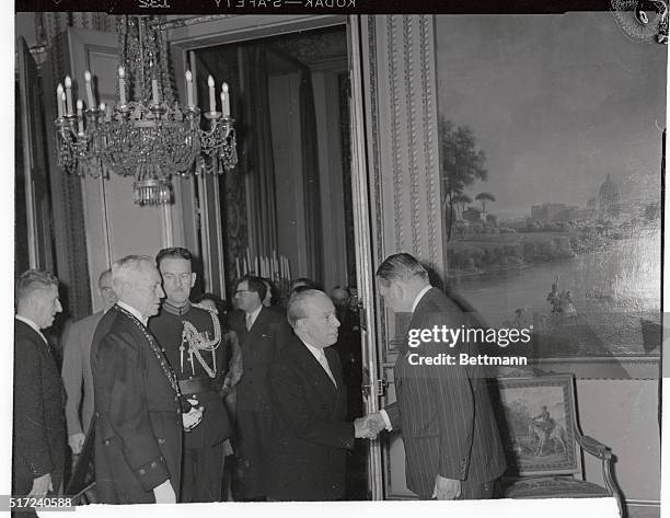 Canadian Ambassador to France Jean Desy, , is greeted by French President Rene Coty at the Elysees Palace during a reception commemorating Bastille...