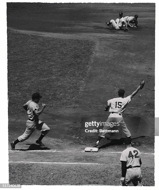 Cleveland's Al Rosen, , is forced out at second on Dave Philley's grounder to shortstop Phil Rizzuto, who threw to second baseman Gerry Coleman, ,...