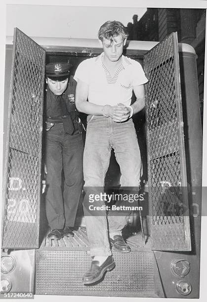 Ernest Lee Edwards leaves a paddy wagon at New York police headquarters here on July 7 to appear in a police lineup in connection with the alleged...
