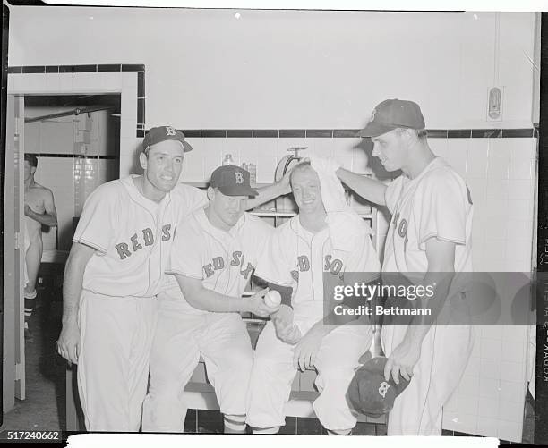 Rookie Russ Kemmerer , gets the royal treatment from his Red Sox teammates after pitching a one hit during his first Major League start as the Boston...