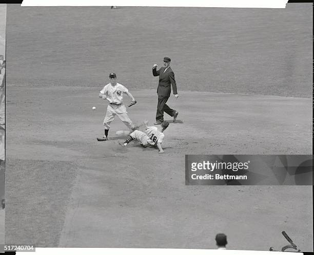 Sunglasses perched on his eyebrows, second baseman Gil McDougald of the New York Yanks forces Baltimore Oriole Cal Abrams at second in the third...